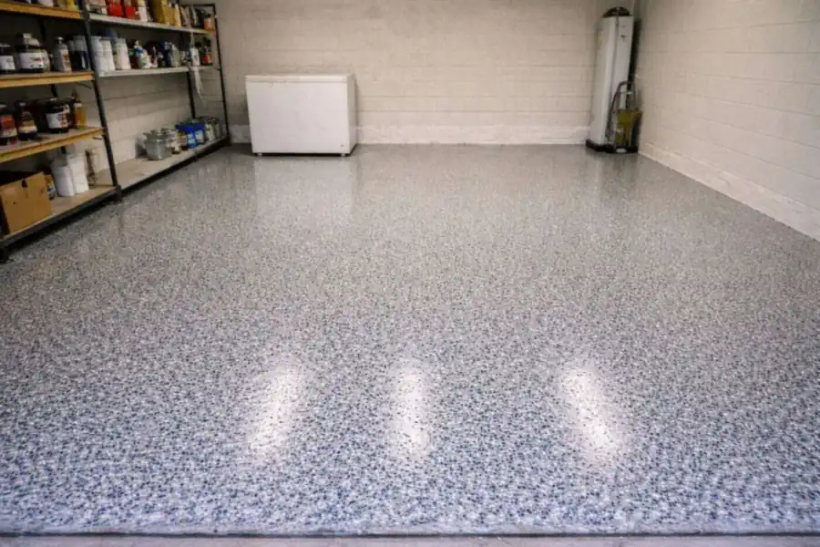 Coated garage floor with a clear top coat